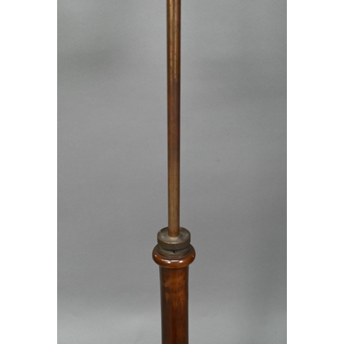 933 - A Victorian mahogany single music stand, with brass rise and fall pole on a tri-form platform base o... 