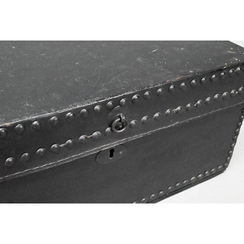 938 - An antique studded black clad leather trunk, with carrying handle to each side, 57 cm x 30cm x 26 cm... 