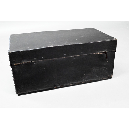 938 - An antique studded black clad leather trunk, with carrying handle to each side, 57 cm x 30cm x 26 cm... 