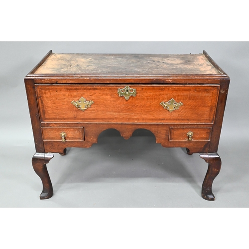 939 - A George II oak chest on stand comprised of two short over three long graduated drawers, over a furt... 