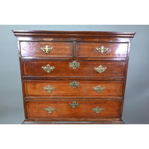 939 - A George II oak chest on stand comprised of two short over three long graduated drawers, over a furt... 