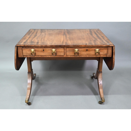 940 - A Victorian mahogany sofa table, the rectangular top with rounded drop leaf ends and beaded edge, ov... 