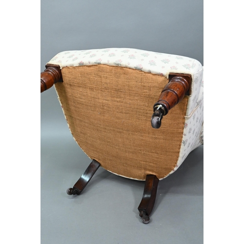 942 - A Victorian button backed armchair, raised on turned front legs on ceramic castors, 85 cm high, 73 c... 