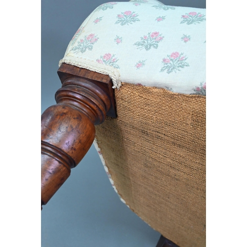 942 - A Victorian button backed armchair, raised on turned front legs on ceramic castors, 85 cm high, 73 c... 