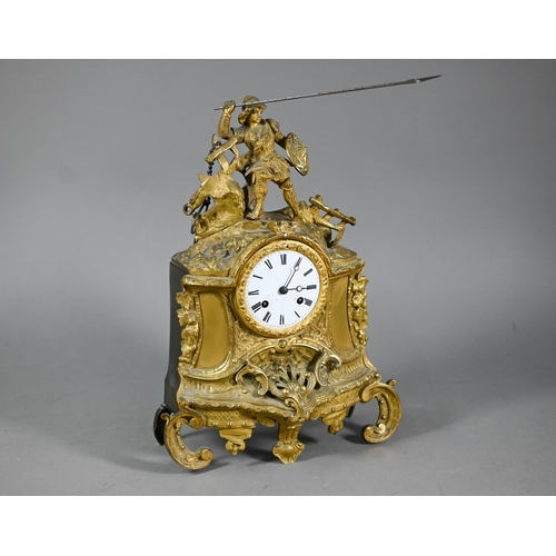 943 - A 19th century ormolu 8-day mantel clock, surmounted by a spear wielding warrior with white enamelle... 