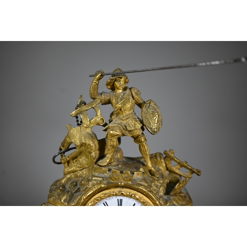 943 - A 19th century ormolu 8-day mantel clock, surmounted by a spear wielding warrior with white enamelle... 