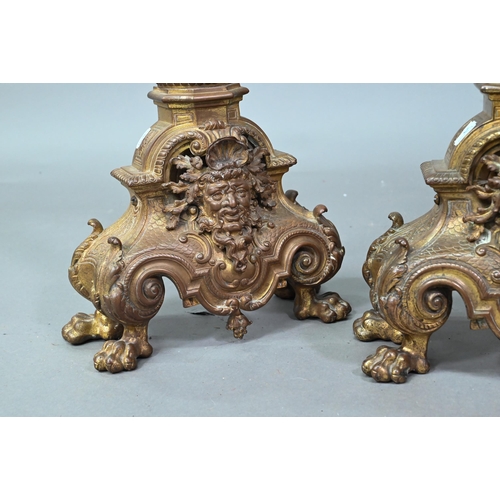 963 - A pair antique cast brass fire dogs, 60 cm h, on iron bracket legs