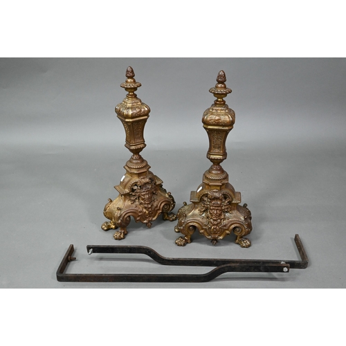 963 - A pair antique cast brass fire dogs, 60 cm h, on iron bracket legs