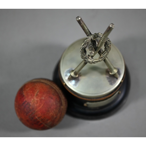 1045 - Cricket: an EPNS trophy modelled as three wreathed stumps to support a leather cricket ball, an ebon... 