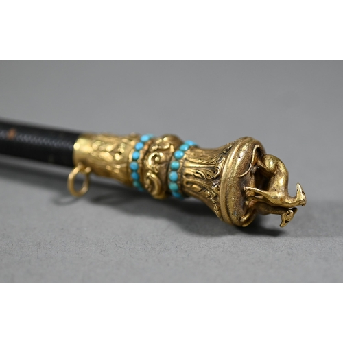 1076 - A Victorian riding crop, the gilt metal pommel surmounted by two lurchers and inset with turquoise b... 