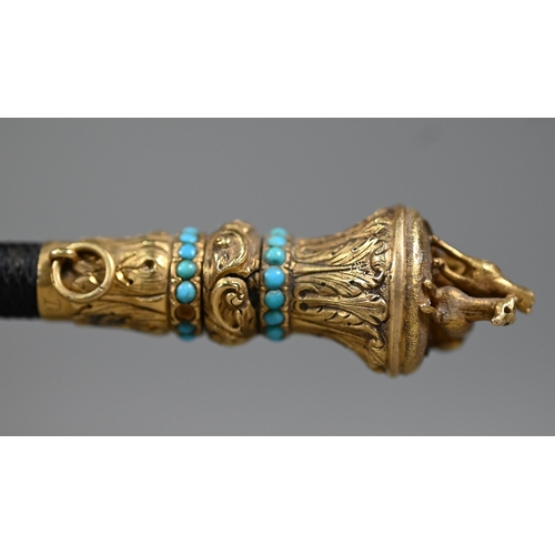 1076 - A Victorian riding crop, the gilt metal pommel surmounted by two lurchers and inset with turquoise b... 