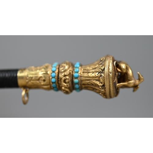 1076 - A Victorian riding crop, the gilt metal pommel surmounted by two lurchers and inset with turquoise b... 