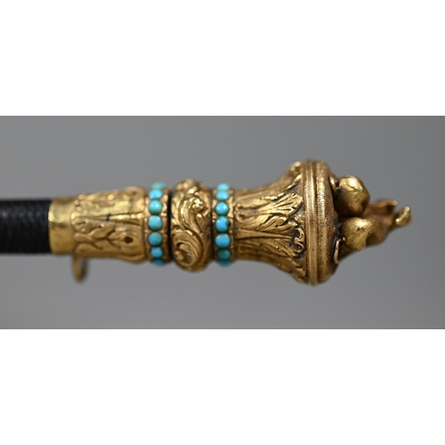 1076 - A Victorian riding crop, the gilt metal pommel surmounted by two lurchers and inset with turquoise b... 