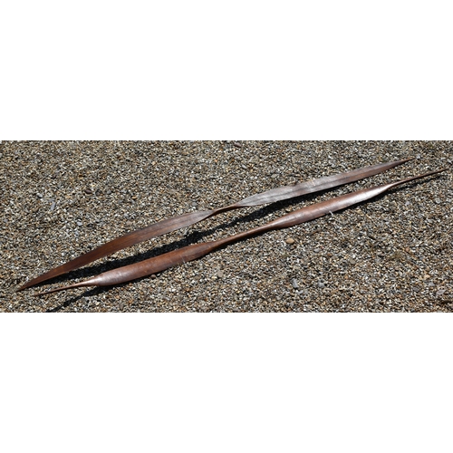 1082 - Two antique Andaman Islands tribal carved wood bows of flattened blade form with tapering handles an... 