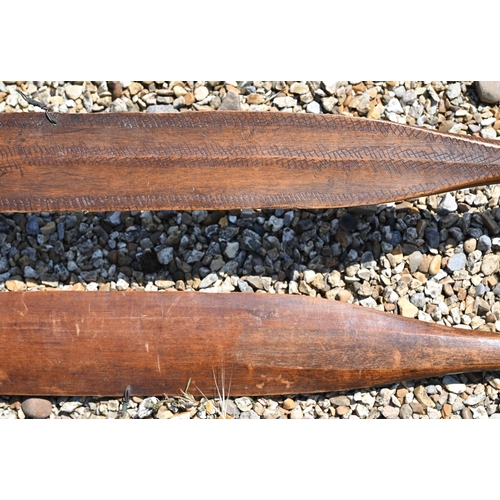 1082 - Two antique Andaman Islands tribal carved wood bows of flattened blade form with tapering handles an... 