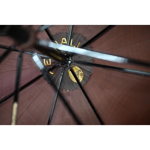 1089 - A lady's vintage umbrella by Kendal, with brown silk canopy on rosewood handle with gilt metal mount... 