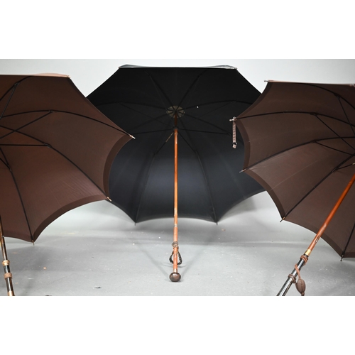 1089 - A lady's vintage umbrella by Kendal, with brown silk canopy on rosewood handle with gilt metal mount... 