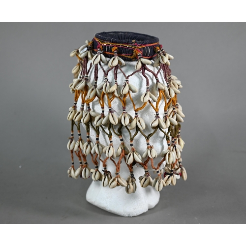 1091 - An African cowry-shell headdress or veil, bound with coloured threads