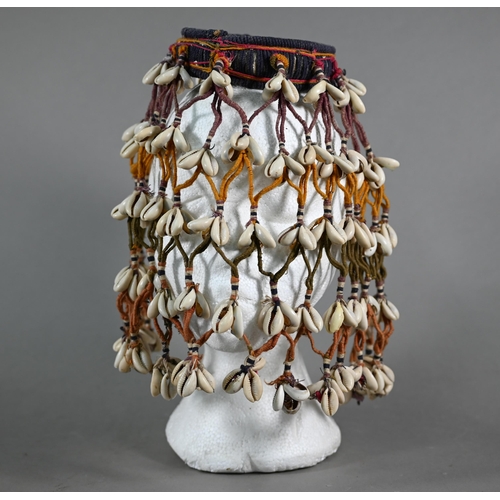 1091 - An African cowry-shell headdress or veil, bound with coloured threads