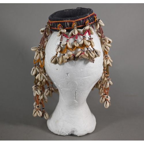 1091 - An African cowry-shell headdress or veil, bound with coloured threads