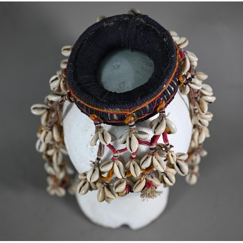 1091 - An African cowry-shell headdress or veil, bound with coloured threads