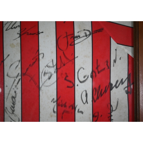 1105 - A Southampton FC football shirt, signed by the team, circa 1990, including Alan Shearer, Kevin Moore... 