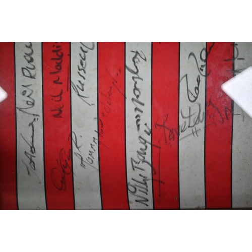 1105 - A Southampton FC football shirt, signed by the team, circa 1990, including Alan Shearer, Kevin Moore... 