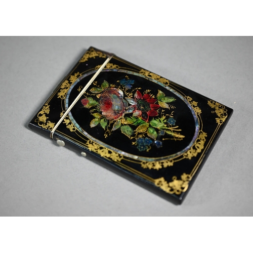 1108 - A Victorian papier-maché visiting card case with painted, gilded and mother-of-pearl inlaid decorati... 