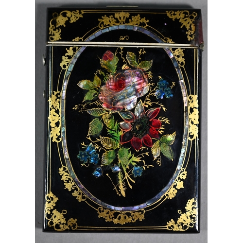 1108 - A Victorian papier-maché visiting card case with painted, gilded and mother-of-pearl inlaid decorati... 