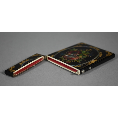 1108 - A Victorian papier-maché visiting card case with painted, gilded and mother-of-pearl inlaid decorati... 