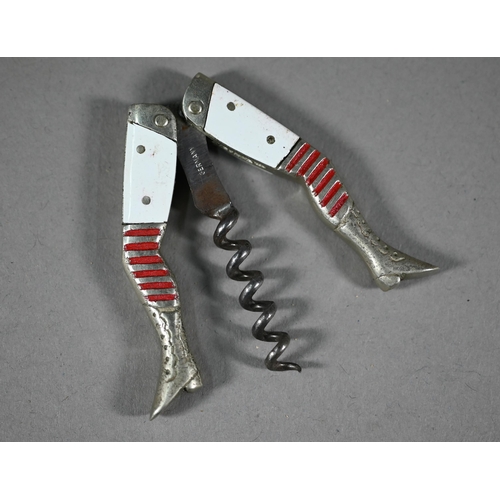 1112 - WITHDRAWN A Belle Epoque vintage novelty 'legs' corkscrew with white enamel thighs and red-striped s... 