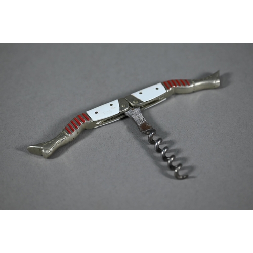 1112 - WITHDRAWN A Belle Epoque vintage novelty 'legs' corkscrew with white enamel thighs and red-striped s... 