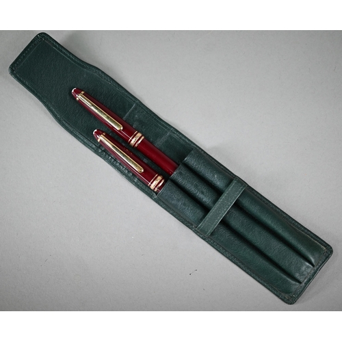 1115 - A Montblanc Meisterstuck fountain pen and ballpoint pen set, with gilt-mounted maroon bodies, the fo... 