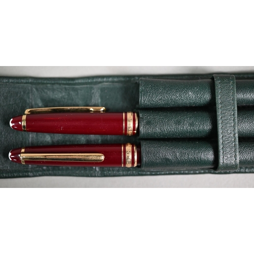 1115 - A Montblanc Meisterstuck fountain pen and ballpoint pen set, with gilt-mounted maroon bodies, the fo... 