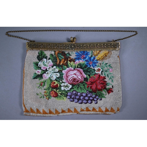 1121 - A glass beadwork bag decorated with flowers, circa 1900, on gilt metal folding clasp fitting, and ch... 