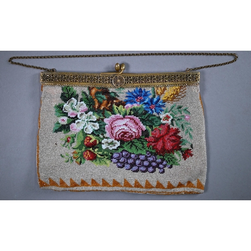 1121 - A glass beadwork bag decorated with flowers, circa 1900, on gilt metal folding clasp fitting, and ch... 