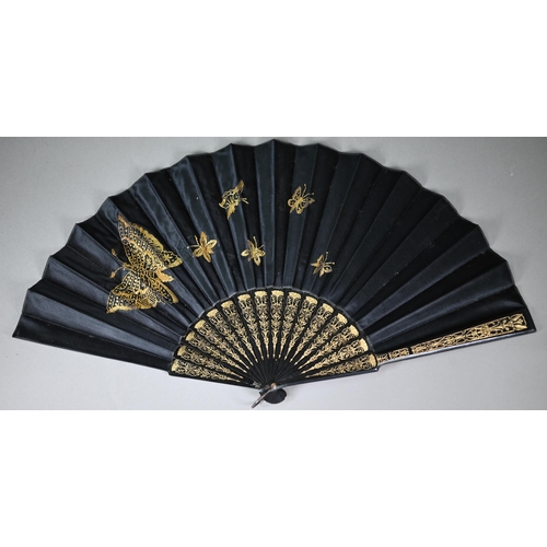 1151 - An antique black silk mourning fan on ebonised and gilt sticks, the leaf embroidered with butterflie... 