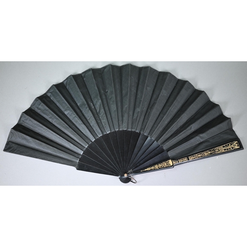 1151 - An antique black silk mourning fan on ebonised and gilt sticks, the leaf embroidered with butterflie... 