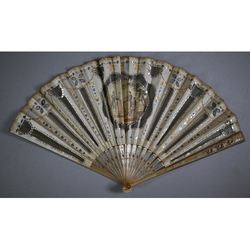 1154 - A 19th century Regency tortoiseshell fan, the silk-mounted wire gauze leaf printed and painted with ... 