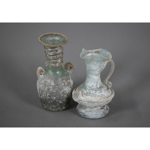 1160 - Two small Roman glass two-handled vessels, 11 and 9 cm high