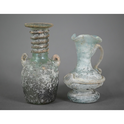 1160 - Two small Roman glass two-handled vessels, 11 and 9 cm high