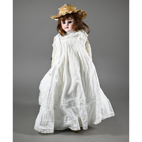 1196 - An early 20th century German Ernst Heubach china-headed girl doll with brown wig, sleeping brown eye... 