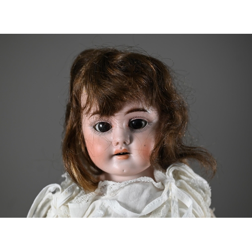 1196 - An early 20th century German Ernst Heubach china-headed girl doll with brown wig, sleeping brown eye... 