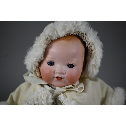 1197 - An Armand Marseille AM351/3 1/2 k bisque-headed baby doll with fixed blue eyes and open mouth with t... 