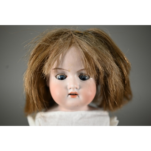 1197 - An Armand Marseille AM351/3 1/2 k bisque-headed baby doll with fixed blue eyes and open mouth with t... 