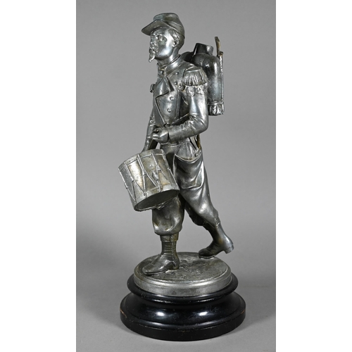 1202 - After Emille Guillemin, a late 19th century French silver patinated spelter figure of a drummer of t... 