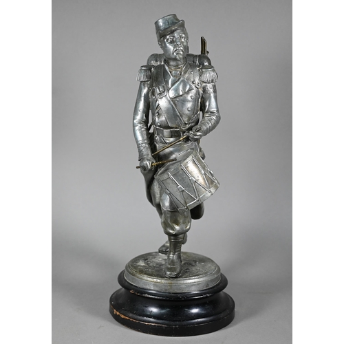 1202 - After Emille Guillemin, a late 19th century French silver patinated spelter figure of a drummer of t... 