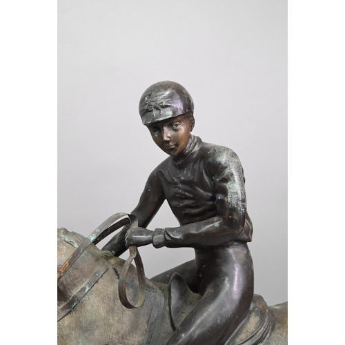 1205 - After Pierre Jules Menes, a patinated bronze sculpture of a mounted jockey, raised on a naturalistic... 