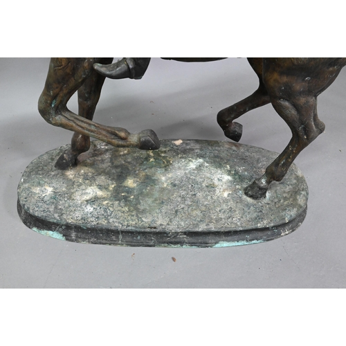 1205 - After Pierre Jules Menes, a patinated bronze sculpture of a mounted jockey, raised on a naturalistic... 