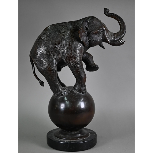 1206 - A cast patinated dark bronze sculpture after A Barye, a trumpeting elephant raised on a globe - on a... 